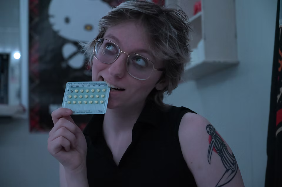 Willow posing with his birth control medication.