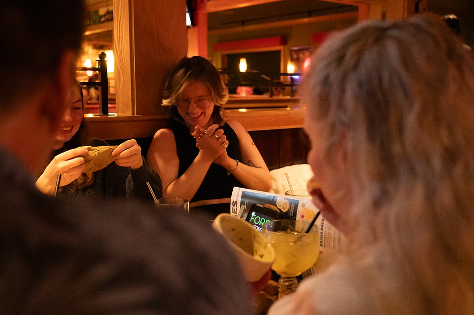 Willow laughing alongside his family.
